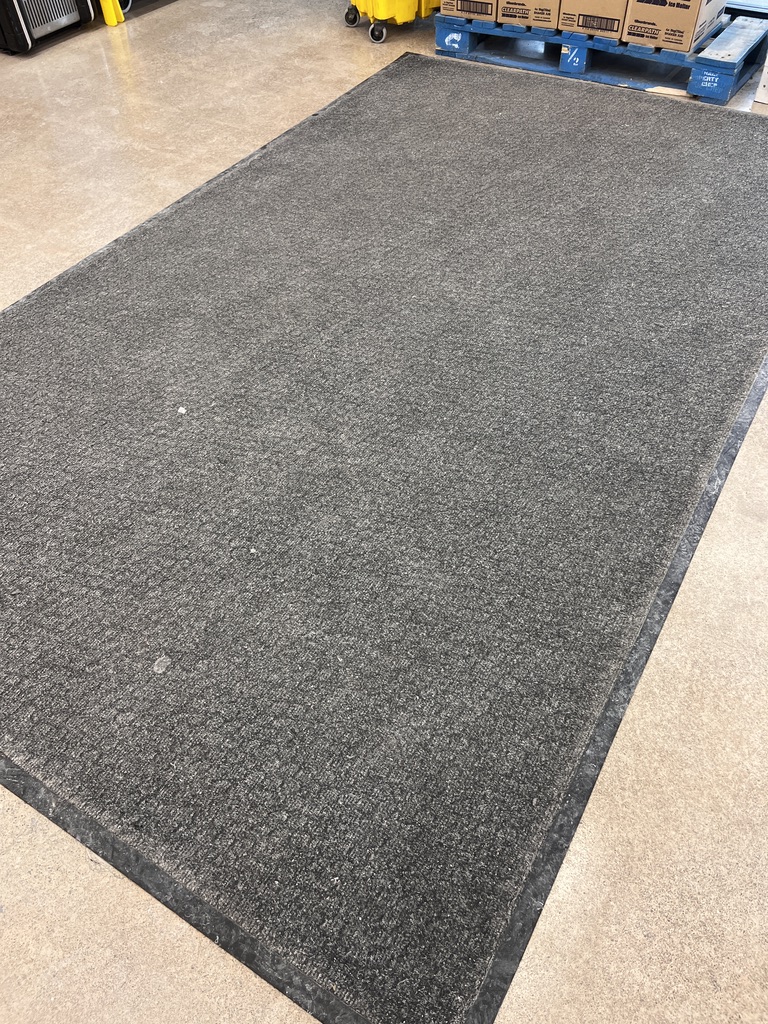 Dirty commercial entrance carpet before professional washing, close view
