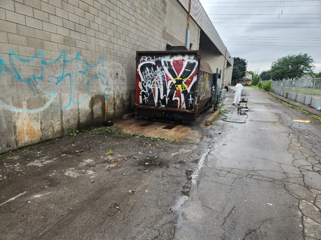 Commercial compactor area cleared after waste removal and cleaning