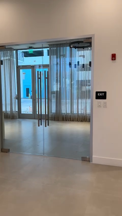 Clean frameless reception glass doors after final detailing